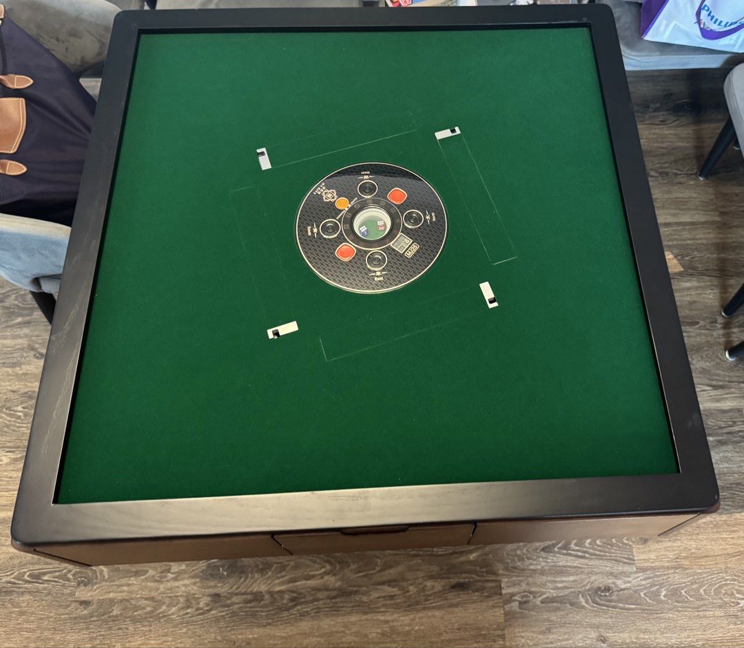 Dining table with Mahjong Table (Category: Tables & Sets) located in Singapore. Submitted by mypunnybunny (Listing ID 1456852550, Image 4). Description: Bought the table at $2.2k, selling at $1.5k - It’s dining table with mahjong table - Comes with 2 sets of tiles - 90cm by 90cm by 82cm height .