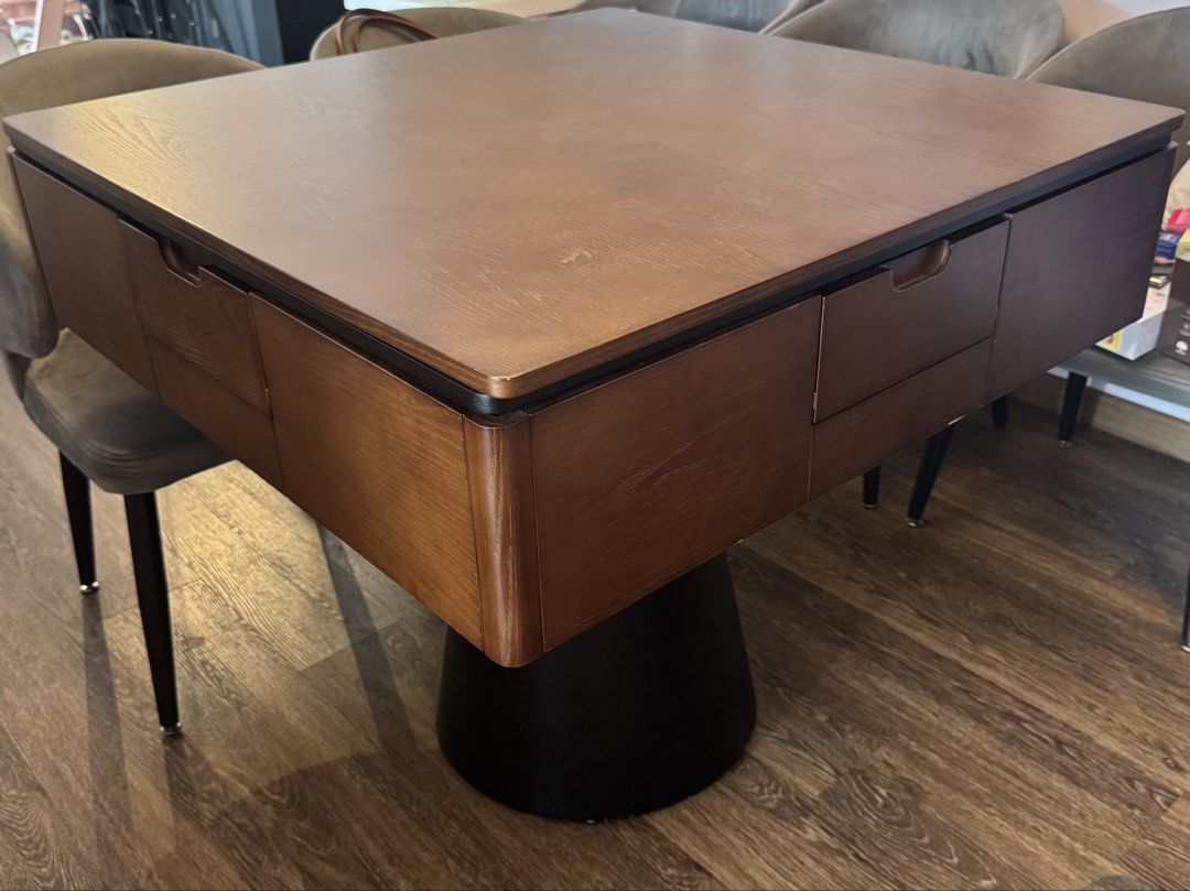 Dining table with Mahjong Table (Category: Tables & Sets) located in Singapore. Submitted by mypunnybunny (Listing ID 1456852550, Image 1). Description: Bought the table at $2.2k, selling at $1.5k - It’s dining table with mahjong table - Comes with 2 sets of tiles - 90cm by 90cm by 82cm height .