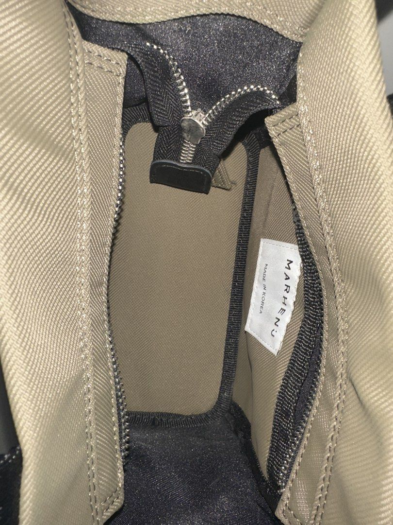 MARHEN.J Milly Nano Bag with Bonus Brand New Detachable Pouch (Category: Tote Bags) located in Singapore. Submitted by hazelnutsabi (Listing ID 1456932862, Image 3). Description: - MARHEN.J tote bag - Color: Olive Green - Includes detachable crossbody strap - Comes with a small zippered pouch - Made in Korea - Zipper closure for main compartment - Spacious interior - Ideal for daily use.