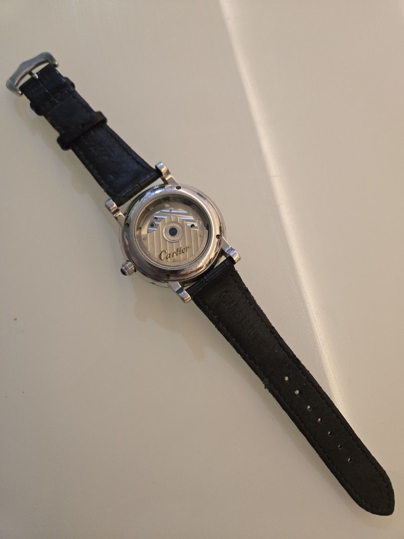 Automatic Watch with Leather Strap (Category: Men's Watches) located in Singapore. Submitted by urban.trader (Listing ID 1458056027, Image 3). Description: - Cartier automatic watch - Visible balance wheel showcasing the movement - Classic Roman numeral dial - Day and year is static - Date is working. - Comes with a blue leather strap and buckle - Exhibition case back to view the movement.
