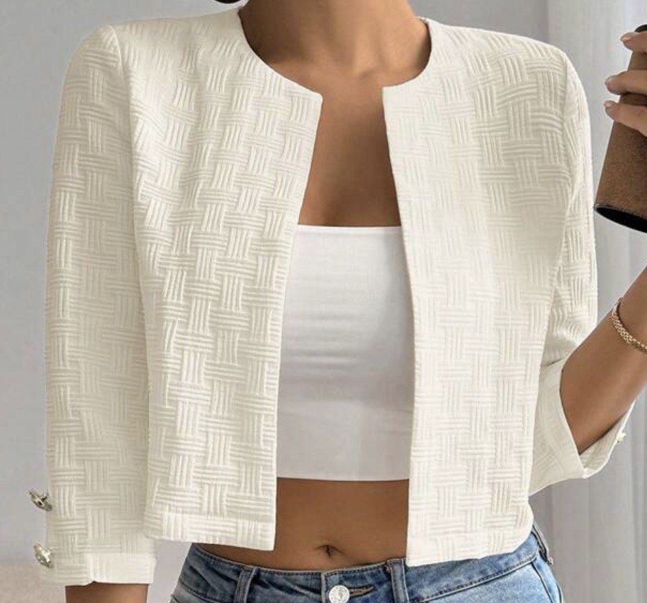 SHEIN Textured Cropped Jacket with Gold Buttons (Category: Coats, Jackets and Outerwear) located in Singapore. Submitted by snowy18486 (Listing ID 1457909655, Image 1). Description: - SHEIN cream textured cropped jacket - Size XS - Open front, no closure - Three-quarter sleeves with decorative gold buttons at cuffs - Ideal for layering over tops or dresses.