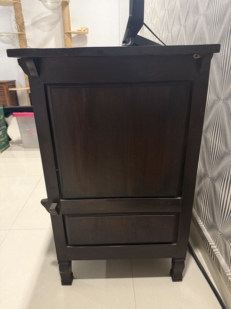 Dark Wood TV Console with Cabinet and Open Shelf (Category: TV Consoles) located in Singapore. Submitted by thepropspantry (Listing ID 1458253326, Image 2). Description: - Dark wood TV console - Cabinet with slatted doors for ventilation - Open shelf at the bottom - Ideal for media equipment or display items - Dimensions: Approx. [L:123cm W:48cm H:80.5] - Versatile design, fits most living room setups -Needs to go by 4 Sep.