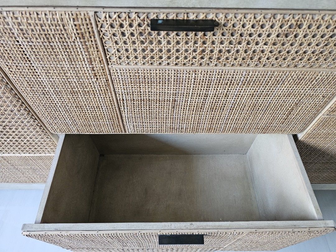 Rooma Rattan TV Console Cabinet with Storage (Category: TV Consoles) located in Singapore. Submitted by sherryssyed (Listing ID 1458391252, Image 5). Description: - Rooma TV console -Light wood TV console - Rattan detailing on doors and drawers - Ample storage space - Features two cabinets with shelves - Includes multiple drawers - Black handles - Ideal for organizing your living room - Approximate dimensions: 1.8m length - Self collect at Tampin