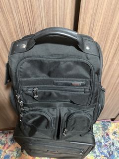Authentic TUMI business backpack in classic black ballistic nylon.