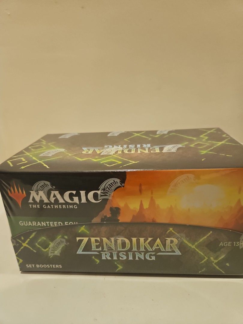 Magic The Gathering Zendikar Rising Set Booster Box (Category: Card Boxes & Cases) located in Singapore. Submitted by philibertg (Listing ID 1453770078, Image 1). Description: - Zendikar Rising Set Booster Box - Features the return of Adventure mechanics - Each pack guarantees at least one Rare or Mythic Rare card - Includes a guaranteed 'Forgotten Realms' card - Ideal for collectors looking to expand their collection - Made in USA.