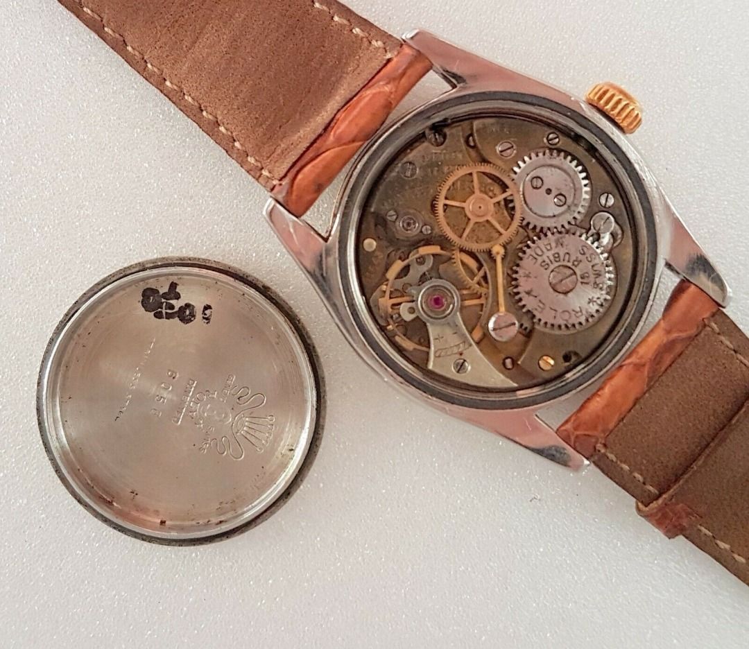 Vintage 1950’s Rolex Speed King Wristwatch, SWISS Made, Distinctive Engine-Turned Bezel, Caliber 5021, Manual Winding Watch, 18 Rubies, Retro 2-Tone Design, Oyster Precision, Tropical Dial, Timeless Classic, Luxury Timepiece, For Collectors, Hobbyists (Category: Watches) located in Singapore. Submitted by discountshop (Listing ID 1453691641, Image 5). Description: The Rolex Speed King is a vintage, manually wound midsize watch, Rolex Oyster Speed