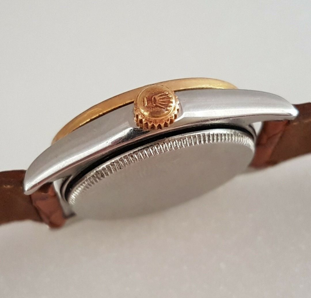 Vintage 1950’s Rolex Speed King Wristwatch, SWISS Made, Distinctive Engine-Turned Bezel, Caliber 5021, Manual Winding Watch, 18 Rubies, Retro 2-Tone Design, Oyster Precision, Tropical Dial, Timeless Classic, Luxury Timepiece, For Collectors, Hobbyists (Category: Watches) located in Singapore. Submitted by discountshop (Listing ID 1453691641, Image 7). Description: The Rolex Speed King is a vintage, manually wound midsize watch, Rolex Oyster Speed