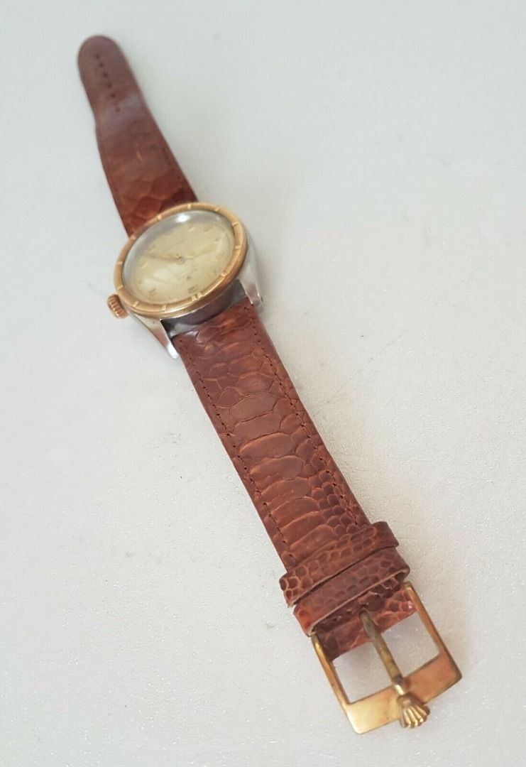 Vintage 1950’s Rolex Speed King Wristwatch, SWISS Made, Distinctive Engine-Turned Bezel, Caliber 5021, Manual Winding Watch, 18 Rubies, Retro 2-Tone Design, Oyster Precision, Tropical Dial, Timeless Classic, Luxury Timepiece, For Collectors, Hobbyists (Category: Watches) located in Singapore. Submitted by discountshop (Listing ID 1453691641, Image 8). Description: The Rolex Speed King is a vintage, manually wound midsize watch, Rolex Oyster Speed