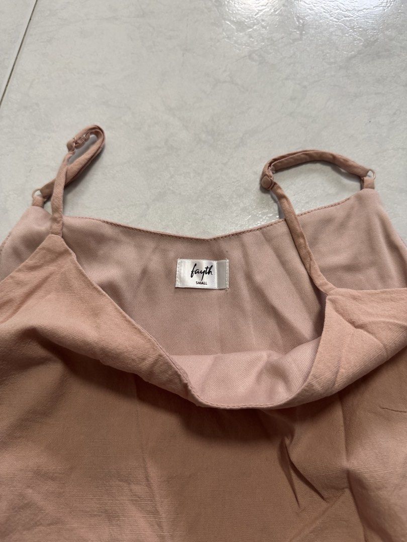 fayth salmon pink babydoll low cut v neck top (Category: Sleeveless) located in Singapore. Submitted by wxcloset (Listing ID 1454744570, Image 2). Description: - Nike basketball shoes - Classic and sporty design - Comfortable and durable - Perfect for basketball or casual wear.